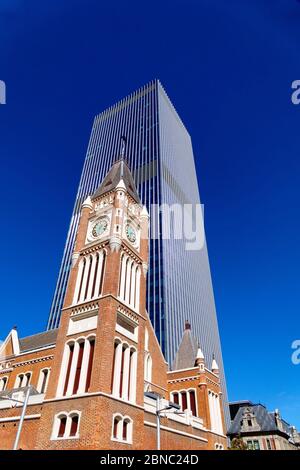 Historical Perth town hall dwarfed by the modern Supreme court building, Perth, Western Australia Stock Photo