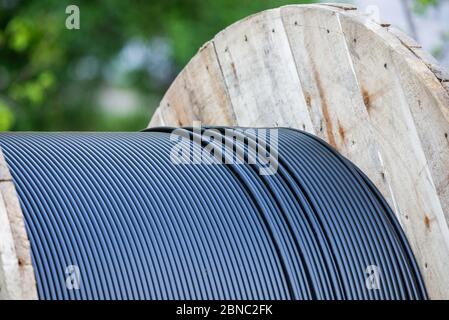 Cable drum, fiber-optic cable or wire and technology. Stock Photo