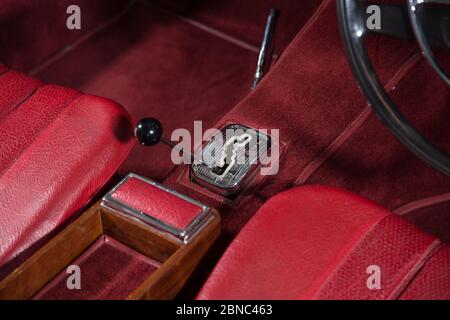 High angle shot of the gear stick of a luxury red car under the lights Stock Photo