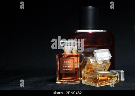 Paris, France on 13th May in 2020 : Chanel perfume bottles isolated on black background. Bottles with different Chanel perfume products. Stock Photo