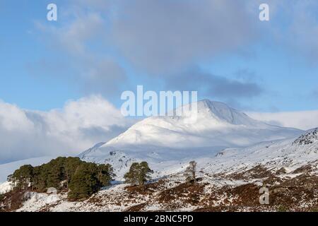 Early morning sun on snow capped Sgurr na Lapaich, Glen Affric, Scotland Stock Photo