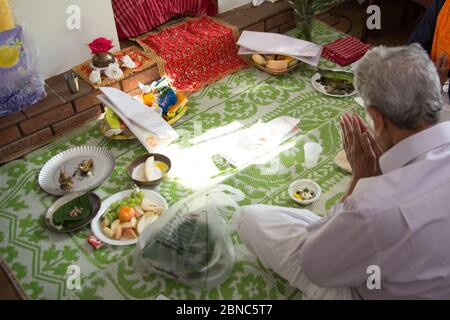 High angle shot of a male praying before having dinner Stock Photo