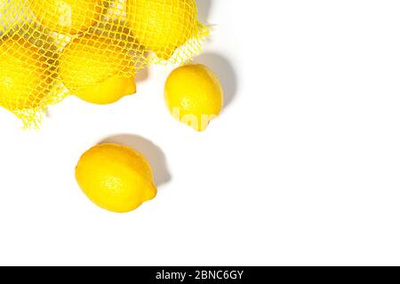 Creative layout made of yellow lemons on white color background. Trendy summer minimal concept. Flat lay, close up. Stock Photo