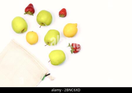 Summer fruits in reusable eco friendly cotton mesh bag. Online delivery idea. Sustainable lifestyle. Grocery from local farmers market in textile bag. Stock Photo