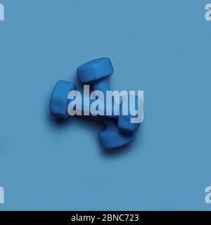 Two dumbbells of blue color isolated on a light blue background. Healthy lifestyle concept. Stock Photo
