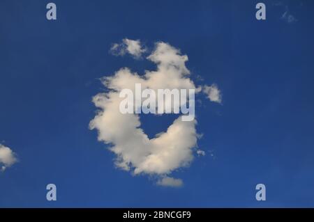 Heart shaped cloud on a blue sky Stock Photo