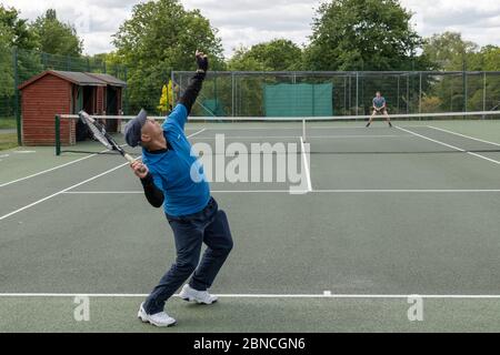 Brockwell Park, UK. 14th May 2020. People playing tennis in Brockwell Park following Government advice that lockdown rules have been relaxed for a small number of sports. Tennis, along with golf and basketball, have been cited as a sport that can be played safely, while keeping two metres apart. Brockwell Park is a 50.8 hectare park located south of Brixton, in Herne Hill and Tulse Hill in south London. (photo by Sam Mellish / Alamy Live News) Stock Photo