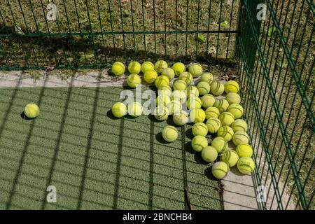 Brockwell Park, UK. 14th May 2020. Tennis balls in Brockwell Park following Government advice that lockdown rules have been relaxed for a small number of sports. Tennis, along with golf and basketball, have been cited as a sport that can be played safely, while keeping two metres apart. Brockwell Park is a 50.8 hectare park located south of Brixton, in Herne Hill and Tulse Hill in south London. (photo by Sam Mellish / Alamy Live News) Stock Photo