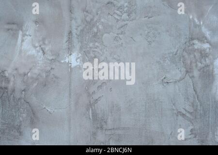 Gray cement wall texture. repair work. Priming the wall with cement mortar. Texture of old gray concrete wall for background Stock Photo