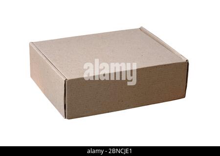 Cardboard box on a white background isolate. Closed brown box home delivery. A small rectangular box for storing things and parcels. Stock Photo