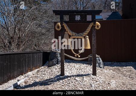 Yamanashi, Japan - March 24, 2019 : View of the place of kawarake Nage or clay cup or Pottery throwing at the circle of Torii for blessing with relati Stock Photo
