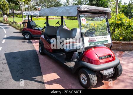 Samut Prakan, Thailand -February16, 2016: View of red traveling golf cart  parks at Ancient City or Ancient Siam or Mueang Boran, outdoor park museum Stock Photo