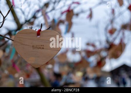 Shizuoka, Japan - March 23, 2019: View of the heart wooden tag of Mishima Skywalk hangs on the tree, a pedestrian bridge officially known as the Hakon Stock Photo