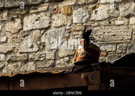 Budapest, Hungary - October  11, 2019: View of Busby on the roof next to the old wall, a military head-dress made of fur, originally worn by Hungarian Stock Photo