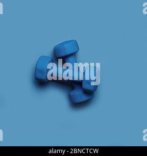 Two dumbbells of blue color isolated on a light blue background. Healthy lifestyle concept. Stock Photo
