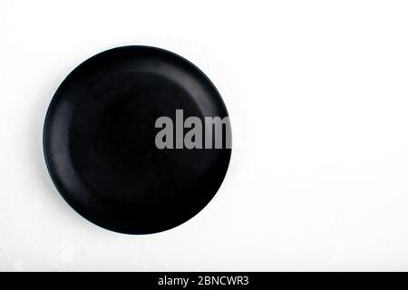 Black stone slate serving plate heart shaped, isolated on white background. Simple, no ingredients, space for copy text Stock Photo