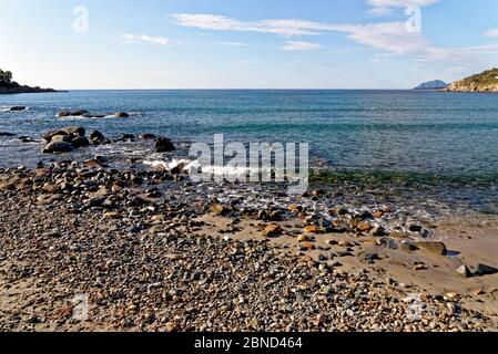 Landscape of Bathing beach Porto Frailis on the rocky coast of Sardinia - Arbatax, Tortol, Ogliastra, Italy - 19th of May 2919 Stock Photo