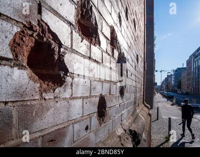 Damage from the Battle of Berlin on wall of S-Bahn bridge in central Berlin, Germany Stock Photo