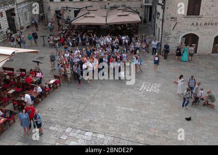 Montenegro, Sep 22, 2019: A large group of tourists at the Saint Tryphon Square in Kotor Old Town Stock Photo