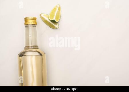 Download Top View Of Golden Tequila In Bottle With Lime On White Marble Surface Stock Photo Alamy Yellowimages Mockups