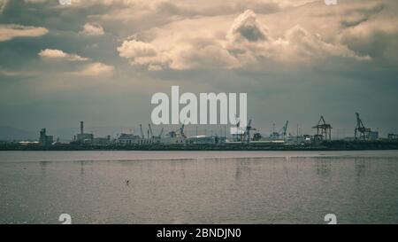 Dublin Port with large industrial cranes, moody colors Stock Photo