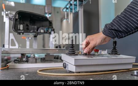 quality engineer controls an instrument for 3D measurement of plastic castings in the automotive industry Stock Photo