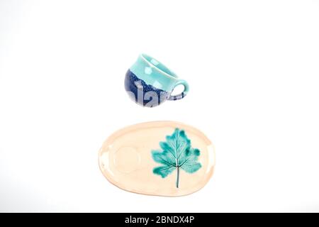 colorful handmade ceramic cups on white background isolated Stock Photo
