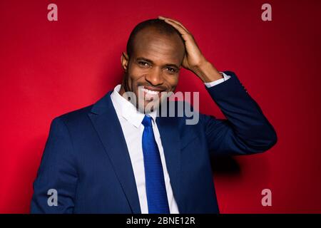 Close-up portrait of his he nice attractive classy cheerful cheery guy partner leader metrosexual wearing tux tuxedo touching shaved head isolated Stock Photo