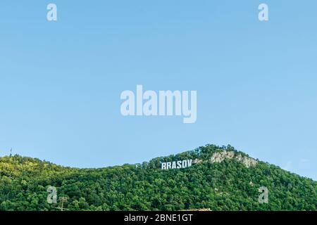 The name of Brasov in volumetric letters on the Tampa mountain from City Hall Square, Romania Stock Photo