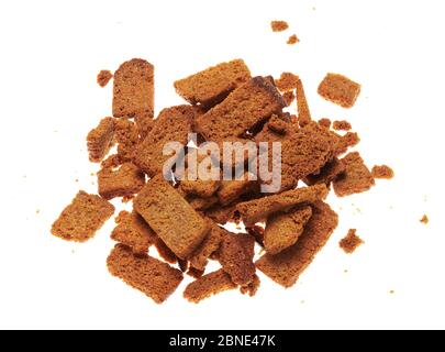 rye crackers, small dried pieces of bread with spices, delicious fast food isolated on white background Stock Photo