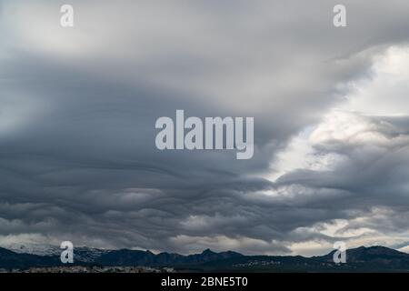 Dramatic sky. Interesting unusual lenticular clouds. Stock Photo