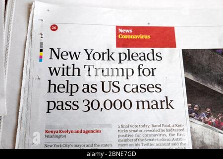 Guardian newspaper inside page Covid headline article clipping 'New York pleads with Trump for help as US cases pass 30,000 mark' March 2020 UK Stock Photo