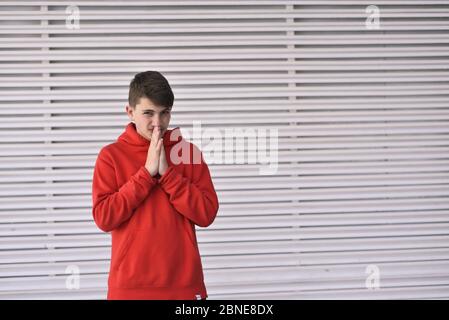 portrait of smiley teenager. dressing in a red shirt Stock Photo