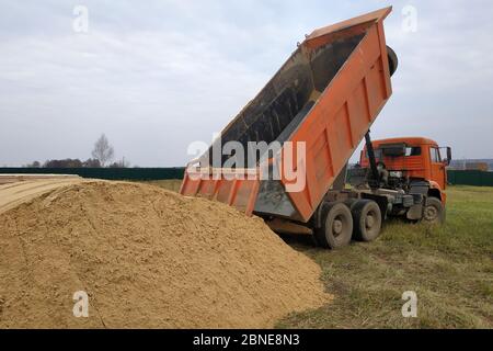 sand dump truck moving unloads orange bournemouth articulated following beach alamy