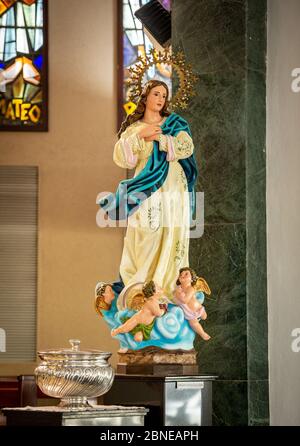 Beautiful vertical shot of a Mary, mother of the Jesus statue Stock Photo