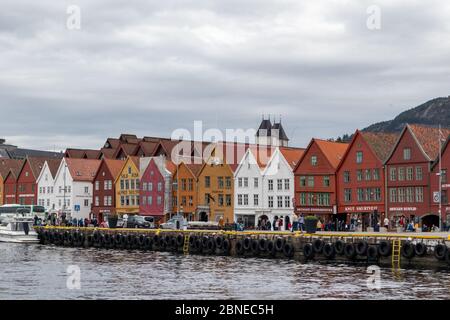 Sea water view on historical buildings in Hanseviertel Bryggen wharf in Bergen, Norway. UNESCO World Heritage Site Stock Photo