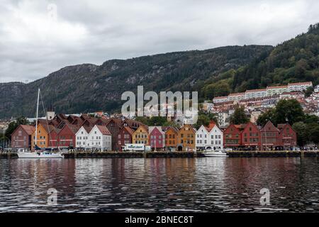 Bergen, Norway - September 09, 2019: Sea water view on historical buildings in Hanseviertel Bryggen wharf in Bergen, Norway. UNESCO World Heritage Sit Stock Photo