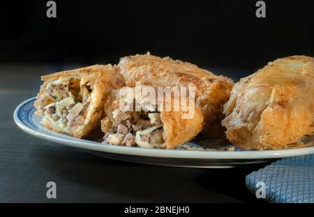chinese food, egg rolls on a plate in a black Background Stock Photo