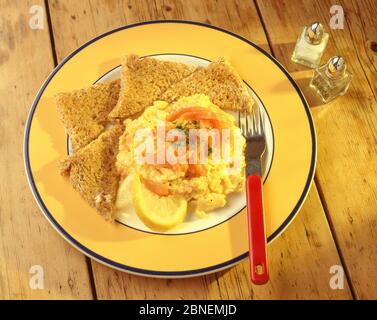 Scrambled egg with smoked salmon and toast, Winkfield, Berkshire, England, United Kingdom Stock Photo