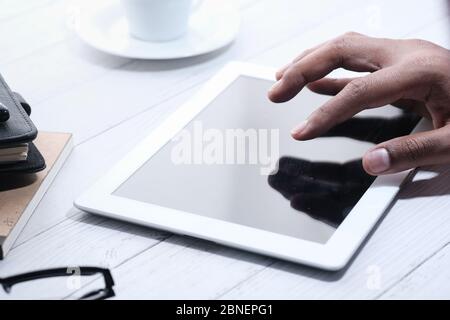 close up of man's hand using digital tablet with empty screen  Stock Photo