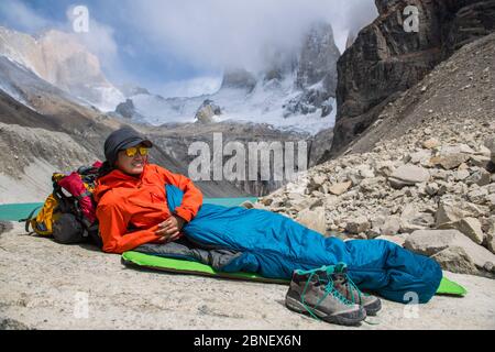 Female hiker camping out at Torres del Paine National Park Stock Photo