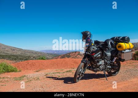 Touring motorbike parked on dirt road, Salta, Argentina Stock Photo