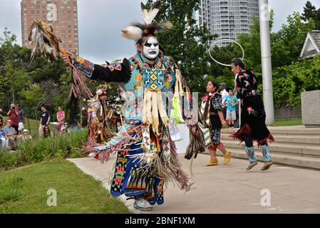 Toronto, Ontario / Canada - July 01, 2017: Indigenous native People in traditional Native Canadian clothing performing the traditional dance in the Ca Stock Photo