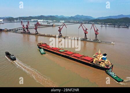 Cargo ships containing goods unload at the world's busiest port, the Port of Ningbo-Zhoushan, Ningbo city, east China's Zhejiang province, 8 April 202 Stock Photo