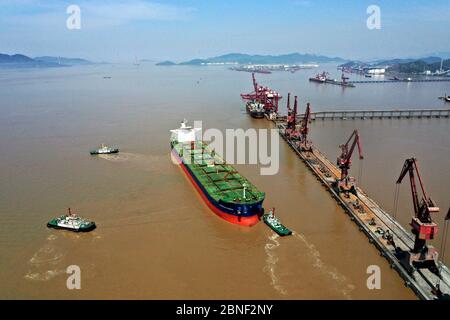 Cargo ships containing goods unload at the world's busiest port, the Port of Ningbo-Zhoushan, Ningbo city, east China's Zhejiang province, 8 April 202 Stock Photo