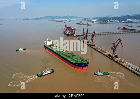 Cargo ships containing goods unload at the world's busiest port, the Port of Ningbo-Zhoushan, Ningbo city, east China's Zhejiang province, 8 April 202 Stock Photo