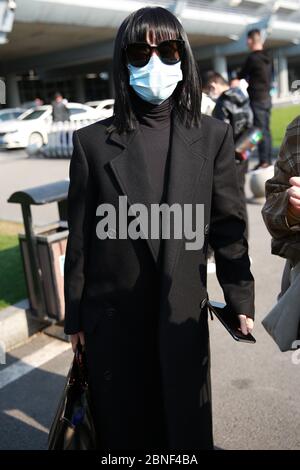 Chinese television and film actress Tan Zhuo arrives at a Changsha airport after landing in Changsha city, south China's Hunan province, 14 April 2020 Stock Photo