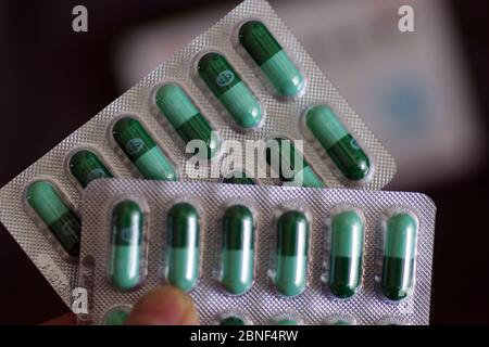 In this unlocated photo, a customer holds a box of Lianhua Qingwen capsule, 14 April 2020. Lianhua Qingwen capsule/capsule is a patented new drug for Stock Photo