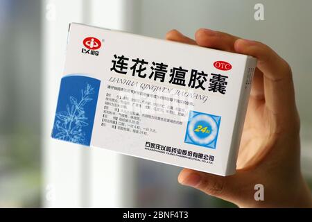 In this unlocated photo, a customer holds a box of Lianhua Qingwen capsule, 14 April 2020. Lianhua Qingwen capsule/capsule is a patented new drug for Stock Photo