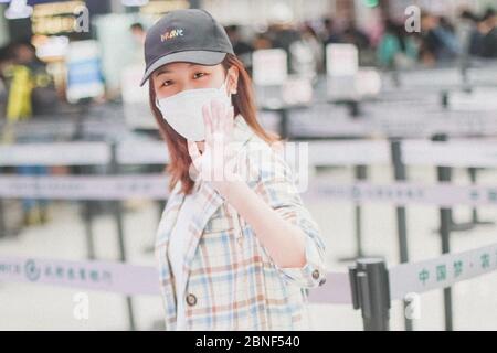 Chinese actress Yan Zhichao arrives at a Chengdu airport before departure in Chengdu city, southwest China's Sichuan province, 12 April 2020. Stock Photo